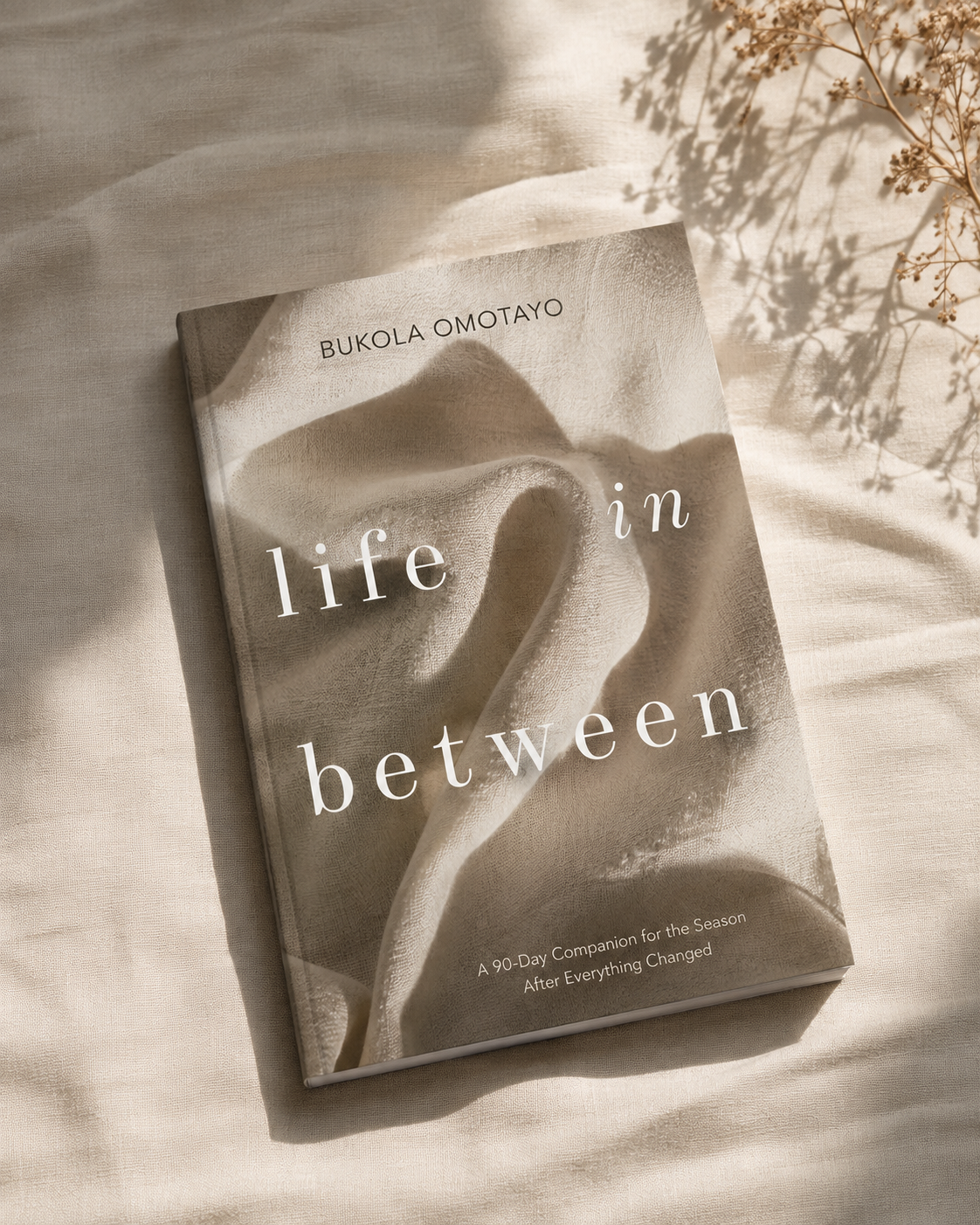 Life in Between by Bukola Omotayo, resting on linen